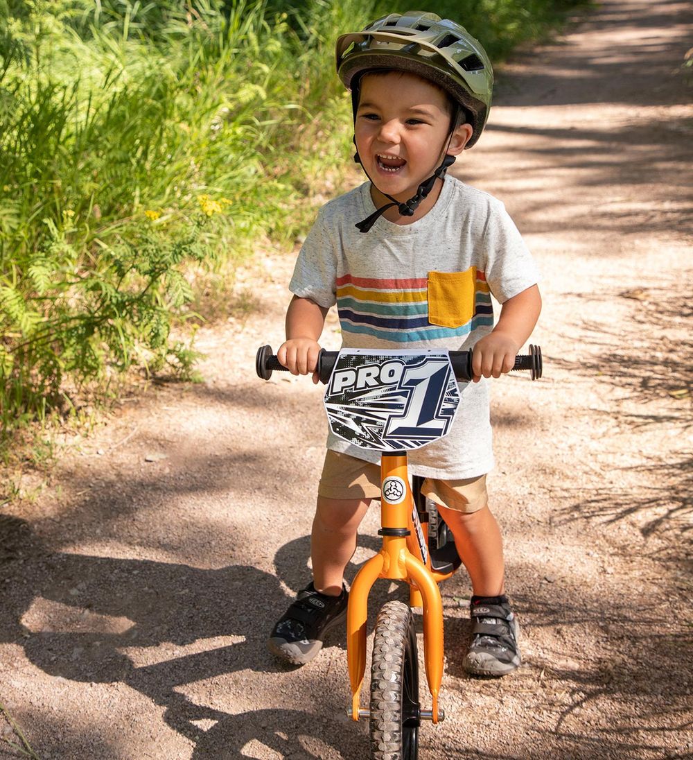 Strider - 12" Pro Balance Bike - Ultra Lightweight Fast Racing Children's Bike - Orange